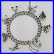 1961-Vintage-925-Sterling-Silver-Charm-Bracelet-with-Heart-Padlock-and-7-Charms-01-luy