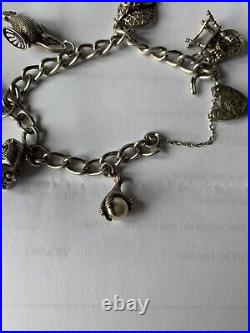 1970's antique silver Stamped charm bracelet with charms