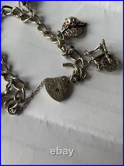 1970's antique silver Stamped charm bracelet with charms