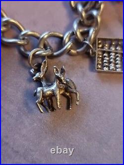 1978 Charm Bracelet Solid Sterling Silver -11 Charms -36.2g. Please Read Info