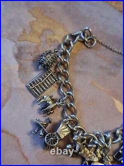 1978 Charm Bracelet Solid Sterling Silver -11 Charms -36.2g. Please Read Info