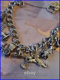 1978 Charm Bracelet Solid Sterling Silver -11 Charms -36.2g. Please Read Info