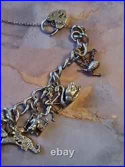 1978 Charm Bracelet Solid Sterling Silver -11 Charms -36.2g. Please Read Info