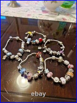 5 Pandora Silver bracelets with charms used