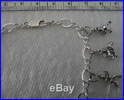7 with all 12 Days of Christmas Sterling Silver on figure 8 Charm Bracelet