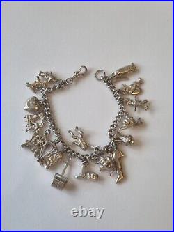 (852) Sterling Silver Charm Bracelet With 18 Traditional Charms, 8 Inch Long