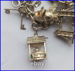 96g. Stunning vintage solid silver charm bracelet & 20 charms, rare, open, move