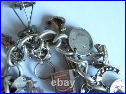 A Vintage Solid Silver Ladies Charm Bracelet With 31 Charms