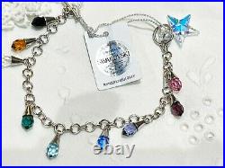 A swarovski crystal sterling silver charm bracelet