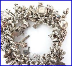 ABSOLUTELY STACKED c1980s STERLING SILVER CHARM BRACELET. APPROX 50 & 131 GRAMS