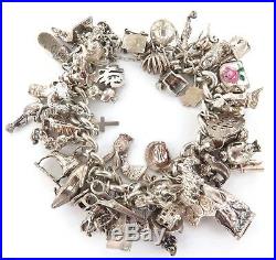 ABSOLUTELY STACKED c1980s STERLING SILVER CHARM BRACELET. APPROX 50 & 131 GRAMS