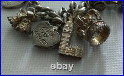 Amazing vintage solid silver chunky charm bracelet & 10 charms. 96g
