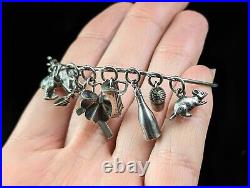 Antique Victorian sterling silver charm bangle, charms