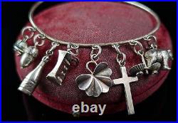 Antique Victorian sterling silver charm bangle, charms