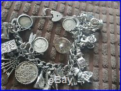 Antique sterling silver charm bracelet. Not scrap lots of charms 125 grams