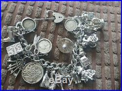 Antique sterling silver charm bracelet. Not scrap lots of charms 125 grams