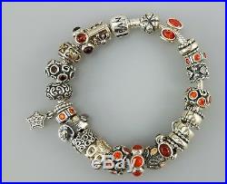 Authentic Pandora silver bracelet with 23 authentic silver charms orange colors