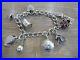 Beautiful-Vintage-Solid-Silver-Charm-Bracelet-With-9-Charms-01-wg