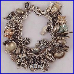 CHARM BRACELET With 40+ STERLING SILVER CHARMS ANGELS FLOWERS SHELLS, 143 grams