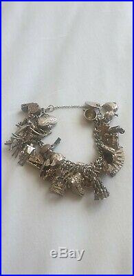 Chunky vintage charm bracelet sterling silver 35 charms, rare, 1970's, collector