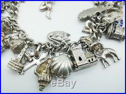 Fabulous Heavy Vintage Sterling Silver Charm Bracelet & 30 Good Charms. 86 gms