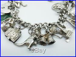 Fabulous Heavy Vintage Sterling Silver Charm Bracelet & 30 Good Charms. 86 gms