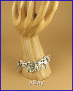 Flower, dragonfly and leaf chunky charm bracelet. Fine & sterling silver