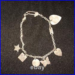 GUCCI. 925 STERLING SILVER TRADEMARK LOGO MULTI-CHARM Bracelet GUCCI. 925 STERLING SILVER TRADEMARK LOGO MULTI-CHARM Bracelet