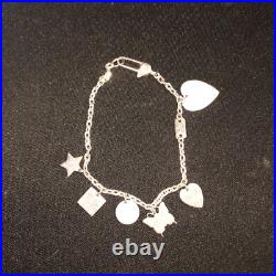GUCCI. 925 STERLING SILVER TRADEMARK LOGO MULTI-CHARM Bracelet GUCCI. 925 STERLING SILVER TRADEMARK LOGO MULTI-CHARM Bracelet