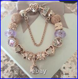 Genuine Pandora Bracelet Rose Gold With charms Beads shown. 19 cms long + Box Genuine Pandora Bracelet Rose Gold With charms Beads shown. 19 cms long + Box