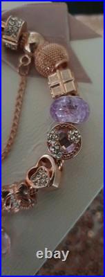 Genuine Pandora Bracelet Rose Gold With charms Beads shown. 19 cms long + Box Genuine Pandora Bracelet Rose Gold With charms Beads shown. 19 cms long + Box