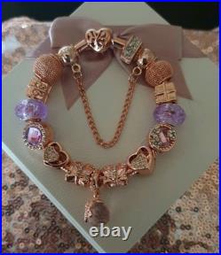 Genuine Pandora Bracelet Rose Gold With charms Beads shown. 19 cms long + Box Genuine Pandora Bracelet Rose Gold With charms Beads shown. 19 cms long + Box