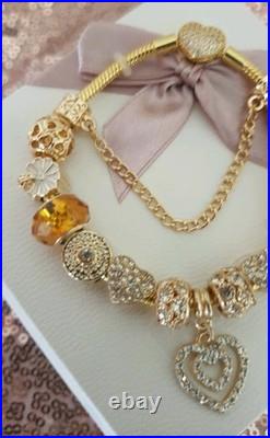 Gold Pandora Bracelet Pave Heart & Gold Charms with Pandora gift Box. 20 cms Gold Pandora Bracelet Pave Heart & Gold Charms with Pandora gift Box. 20 cms