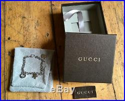 Gucci silver charm bracelet with original packaging superb condition