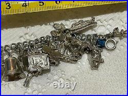 Heavy vintage sterling silver charm bracelet & 44 charms