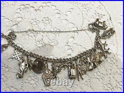 Heavy vintage sterling silver charm bracelet & charms