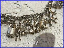 Heavy vintage sterling silver charm bracelet & charms