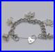 LOVELY-925-STERLING-SILVER-CHARM-BRACELET-WITH-CHARMS-HEAVY-75-92g-7-INCH-01-mo