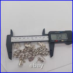 LOVELY 925 STERLING SILVER CHARM BRACELET WITH CHARMS HEAVY (75.92g) 7 INCH