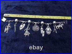Mexican Silver Charm Bracelet. Nine Charms