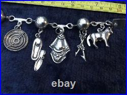 Mexican Silver Charm Bracelet. Nine Charms