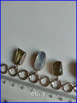 Moonstone 41 gram hallmarked. 925 silver & stone charm bracelet