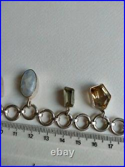 Moonstone 41 gram hallmarked. 925 silver & stone charm bracelet