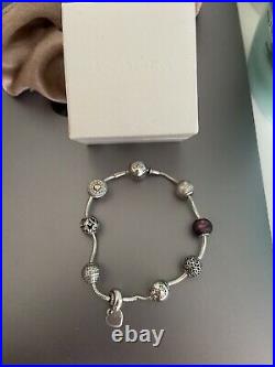 Pandora essence bracelet with charms