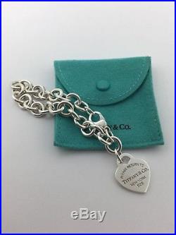 Please return to Tiffany & co. New York sterling silver heart charm bracelet