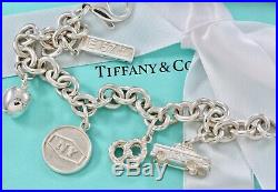 RARE Tiffany & Co. Silver New York Themed Cab Pretzel Apple Charm 7.5 Bracelet