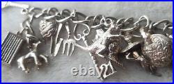 STERLING SILVER CHARM BRACELET WITH 23 UNUSUAL CHARMS 7.5 62.7 g