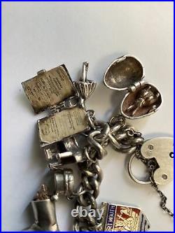 Silver Bracelet With 15 Charms, Some With Moving Parts, Plus Location Tags