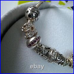 Silver Bracelet by Chamilia with Seven Charms including Grey Zebra