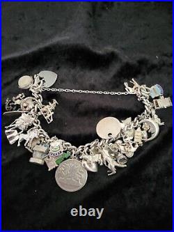 Silver Charm Bracelet 109.60 Grams Over 32 Charms